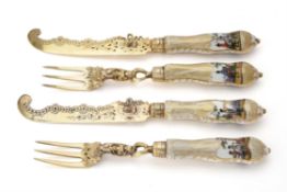 A set of six 19th century German silver gilt and Dresden porcelain dessert knives and forks