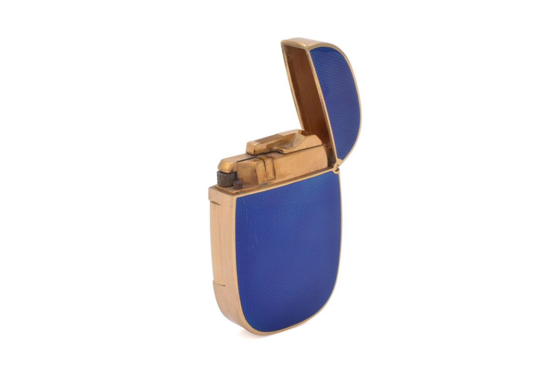 Patek Philippe, Ellipse, a gold coloured and enamel gas lighter - Image 1 of 3