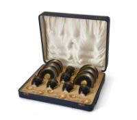 A set of six Royal Worcester bone china coffee cups and saucers with 9 carat gold spoons