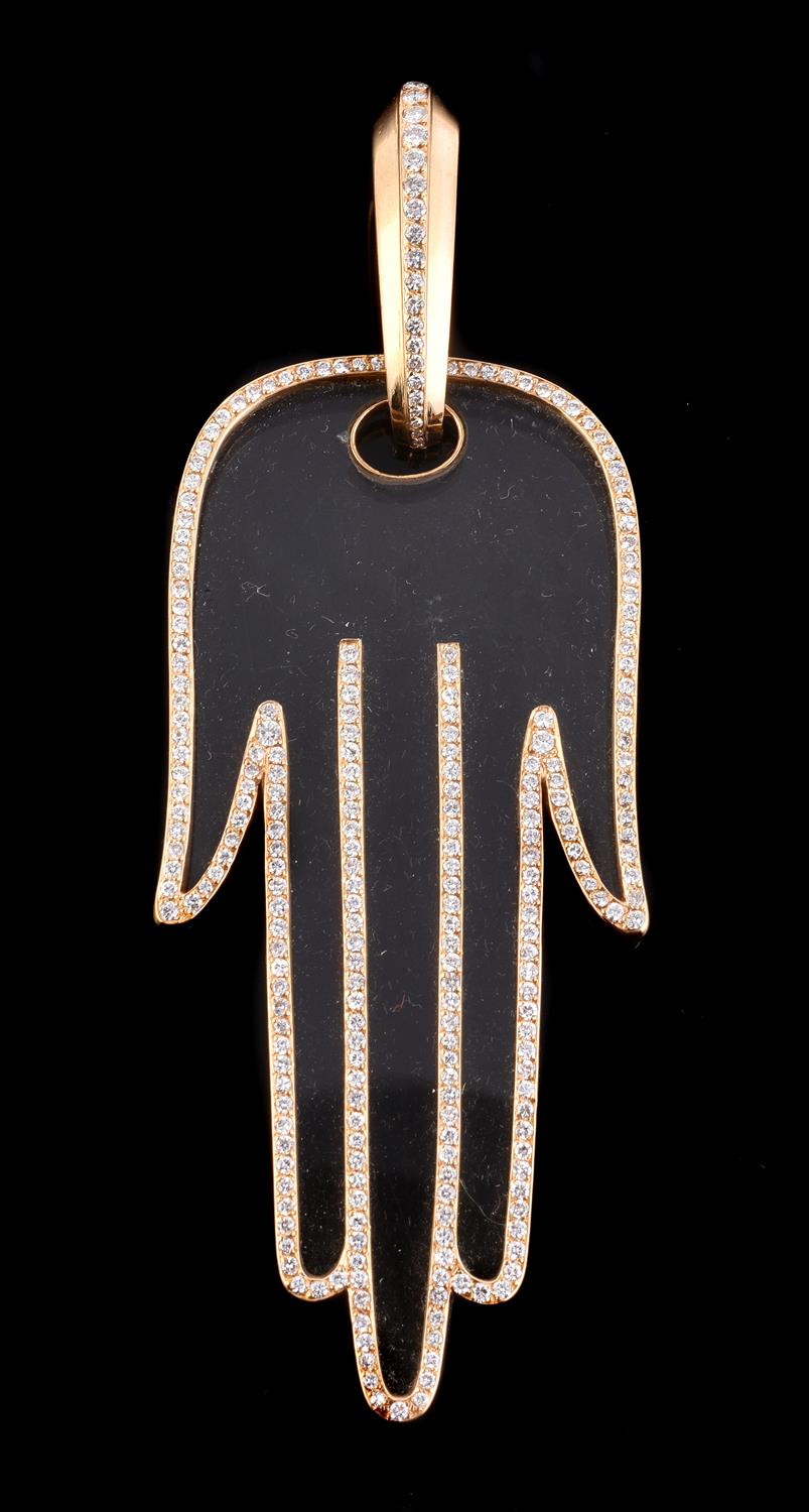 A diamond and rock crystal hand of Fatima pendant by Cartier