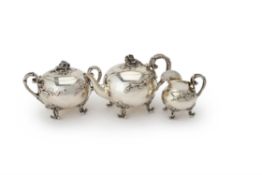 Y A heavy gauge French silver naturalistic three piece tea service in Dutch taste by Henri Chevron