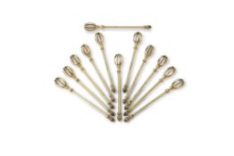A set of twelve French silver gilt cocktail stirrers by Robert Linzeler & Cie.
