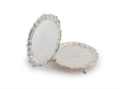 A pair of George II silver shaped circular waiters by William Peaston