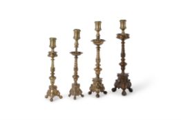 Four assorted Italian gilt bronze pricket altar sticks