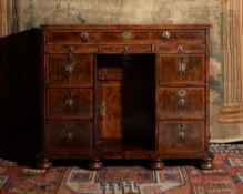 A William & Mary walnut and feather banded kneehole desk