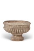 A carved veined white marble cistern