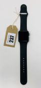 A pre-owned Apple Watch Series 3 38mm Aluminum in Space Grey with M/L Black Sport Band (Serial:
