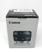 A boxed as new Canon EF 50 mm-f/1.4 USM Lens.