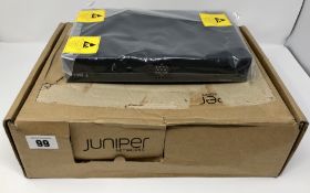 A boxed as new Juniper SRX210 Services Gateway (Model: SRX210HE2) (Inner packaging sealed. No