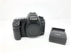 A pre-owned Canon EOS 5D Mark II Digital SLR Camera Body and a pre-owned Canon LC-E6E Battery