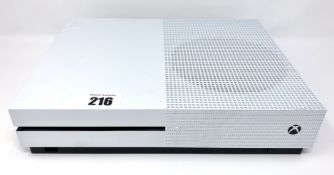 A pre-owned Microsoft Xbox One S 1681 with two controllers, power cable and HDMI cable.