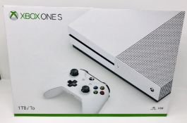 A boxed as new Microsoft Xbox One S 1681 1TB Console (Box opened, some cosmetic damage to box).