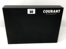 A boxed as new Courant Carry Leather Wireless Charger (Box opened).