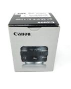 A boxed as new Canon EF 50 mm-f/1.4 USM Lens.