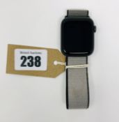 A pre-owned Apple Watch Series 5 GPS 44mm Aluminum in Space Grey with Grey Sport Loop Band (