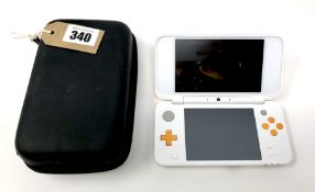 A pre-owned Nintendo 2DS Handheld Console ('New' version) in White/Orange