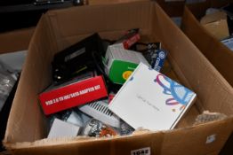 A box of assorted as new and pre-owned small electrical items and accessories.