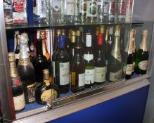 A shelf containing wines/champagnes to include Lindauer, Blossom Hill, Campo Viejo, Bauget-Jouette