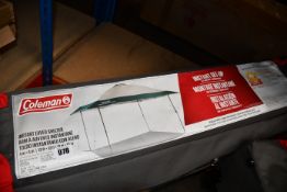 An as new Coleman instant canopy sun shade (13ft x 13ft).