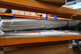 A shelf of miscellaneous items to include plastic tubing and metal support brackets.