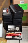 Twelve boxed as new Mag-Lite Solitaire LED flashlights.