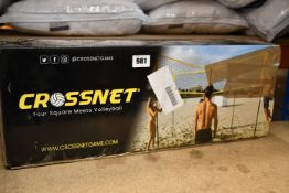A boxed as new Crossnet four square volleyball net.