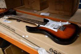 One boxed as new Ibanez GIO electric guitar with a sunburst finish (GRG140-SB).