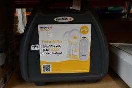 One Medela Symphony breast pump with case.
