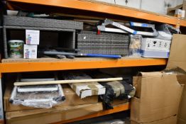 A quantity of garden equipment/tools to include rakes, axe, outdoor pain and planting hoe.