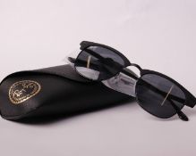 A pair of boxed as new Ray Ban sunglasses.