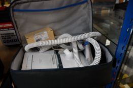 A pre-owned Philips Respironics with carry case.