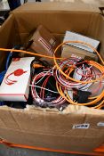 A box of assorted as new and pre-owned small electrical items and accessories.