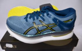 A pair of women's as new Asics Metaride trainers (UK 5).