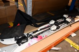 A pair of pre-owned Fischer Koa 80 skis with Vector Tecnopro ski poles and a Rossignol ski bag.