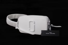 An as new The Marc Jacobs The Snapshot DTM bag in moon white (RRP $250).