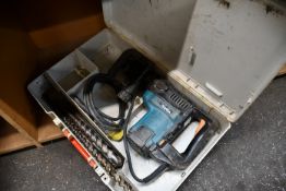 A pre-owned Makita HR4000C SDS-Max rotary demolition hammer drill.