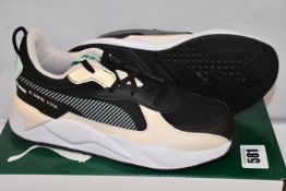 Four pairs of children's Puma RS-X Joy PS trainers (Sizes 13, 1, 1.5 and 2.5).