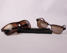 Two pairs of as new Maui Jim sunglasses.