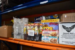 A quantity of assorted food, drink and related items.