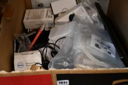 A box of assorted as new and pre-owned small electrical items and accessories.