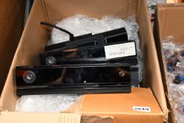 Fifteen pre-owned Microsoft Kinect for Xbox One Sensors (Cables cut, sold for parts only).