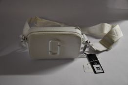 An as new The Marc Jacobs The Snapshot DTM bag in moon white (RRP $250).