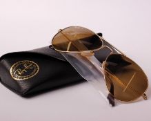 A pair of boxed as new Ray Ban sunglasses.