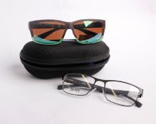 A pair of cased as new Costa sunglasses and a pair of as new unboxed Hugo Boss clear lens glasses.