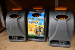 Three as new Hozelock 2 in 1 25m reels (Including fixings).