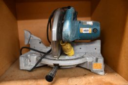 A pre-owned Makita lS1040 mitre saw.