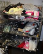 Three baskets containing miscellaneous as new clothing and related items (Baskets not included).