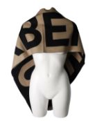 An as new Burberry logo wool jacquard scarf in beige (£220).