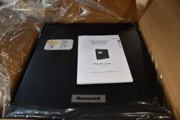 A boxed as new Honeywell HLSPS50 EN54-4 4V 5Ah Power Supply Unit (Box opened).