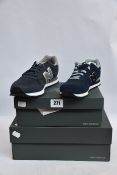 Two pairs of as new New Balance trainers; YC515CP (UK 2.5) and GM500NAY (UK 7.5).